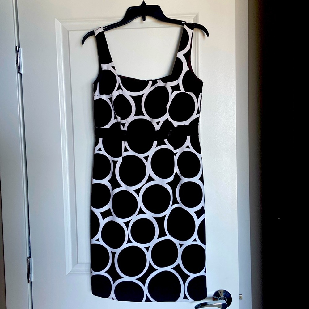 Cute sleeveless summer dress. Geometrical pattern with button detail at bustline